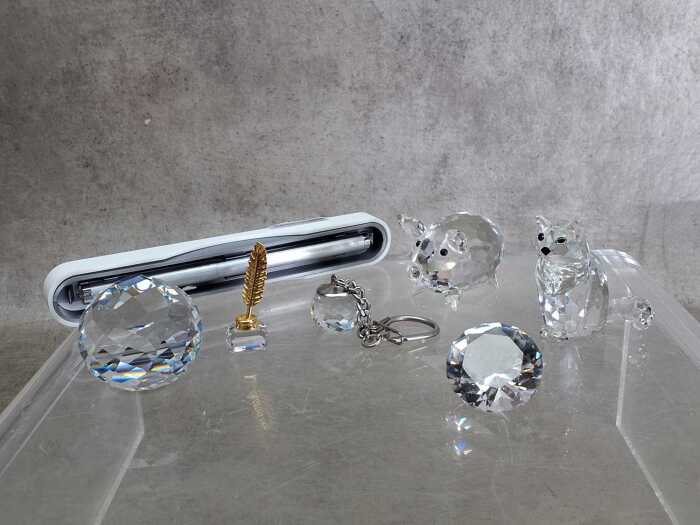 Four Swarovski crystal figures