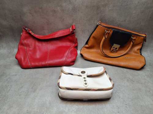 Three designer-style handbags.