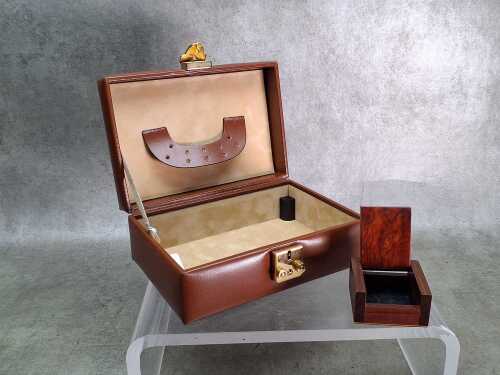 A brown leather jewellery box