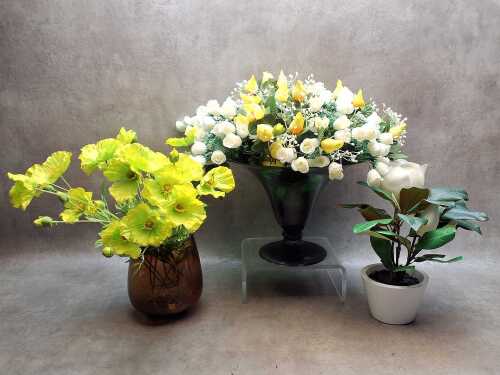 Three potted decorative artificial flowers