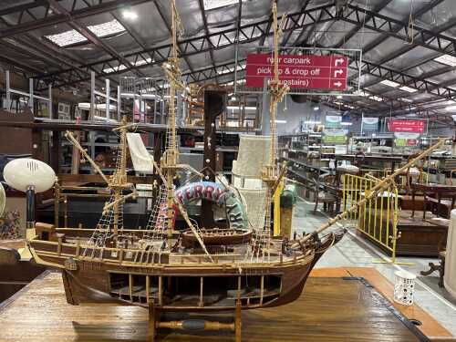 H.M.S Bounty timber ship model on a stand