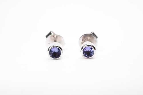 A pair of iolite studs in 18 carat white gold