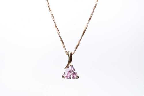 A pink cubic zirconia pendant and necklace in 9 carat yellow gold
