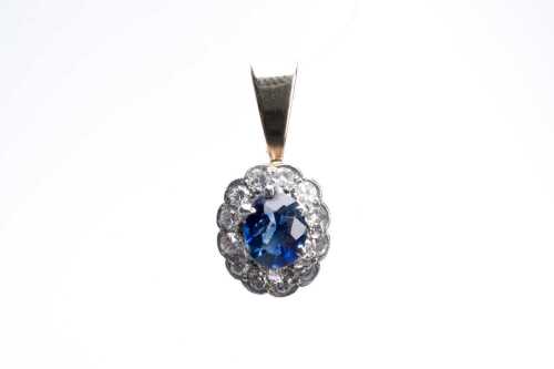 A sapphire and diamond pendant in 9 carat yellow and white gold