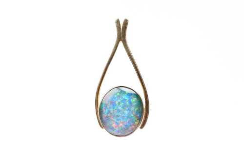 A vintage opal triplet pendant in 9 carat yellow gold
