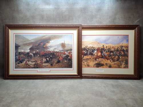 Two military prints on paper in carved timber frames