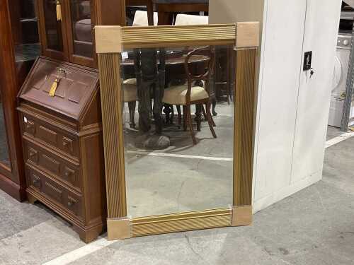 Ornate gilt-effect wall mirror