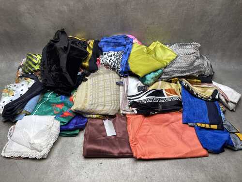 Collection of scarves in various colours and fabrics