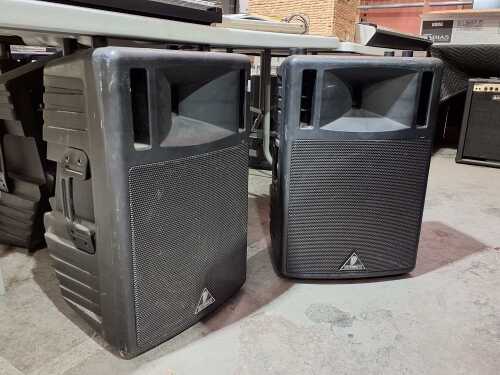 Two Behringer B300 powered PA speaker