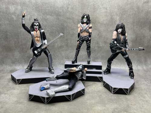 Four limited edition Ikon Collectables Kiss figures on stands