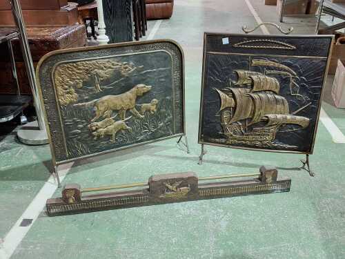 Two embossed brass firescreens, plus a fender