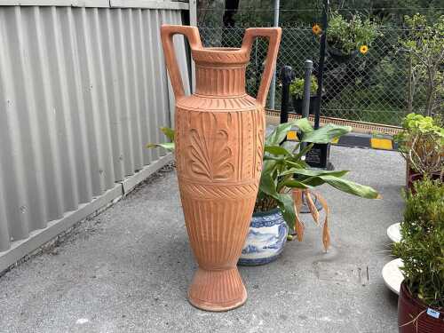 Tall terracotta garden pot
