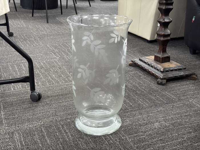 Leaf-etched hurricane clear glass vase.