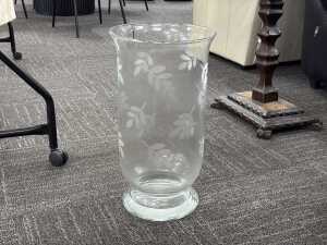 Leaf-etched hurricane clear glass vase.