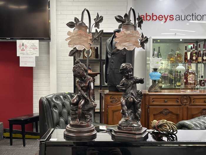 Pair Art Nouveau-style metal and resin figural table lamps