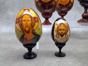 Nine Russian Orthodox hand-painted timber Easter eggs with stands. - 2