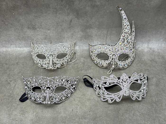 Four silver-toned masquerade masks