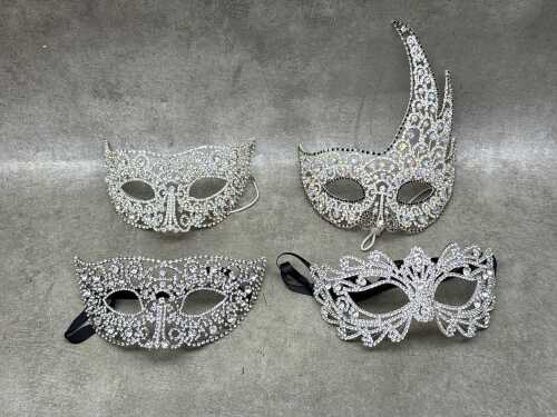91 · Four silver-toned masquerade masks