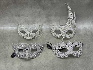 Four silver-toned masquerade masks