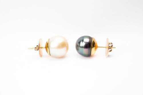 Two single pearl earrings in 18 carat gold with 9 carat backings