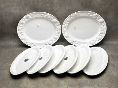 Eight Italian ceramic white platters