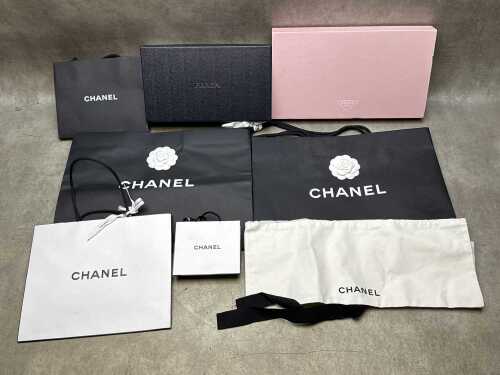 Designer-style packaging in black, white and pink