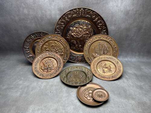 Seven decorative brass and copper wall plates