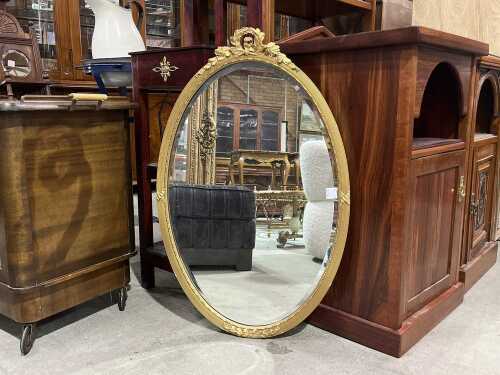 Gilt framed wall mirror with bevelled edge.