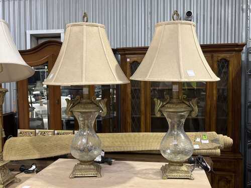 Pair of crackle glass table lamps with ornate resin bases and stems