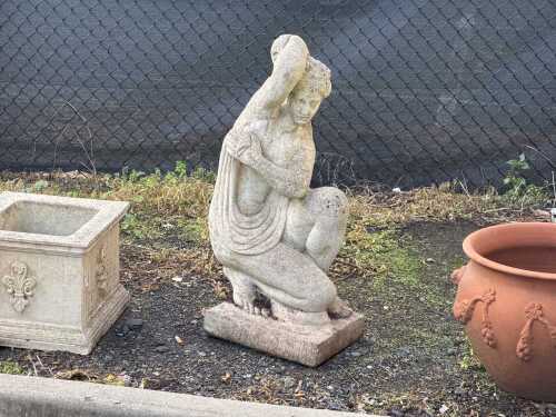 A stone garden figure