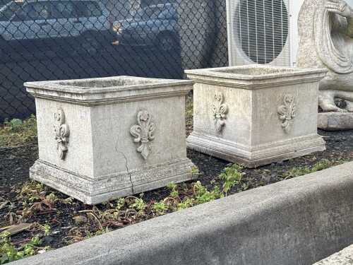 A pair of stone pots