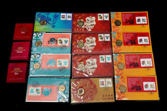 A group of Chinese New Year commemorative coins and stamps