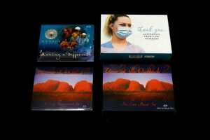 Four Australian proof year and uncirculated coin sets