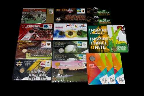 Group of sports themed PNCs and collectable coins
