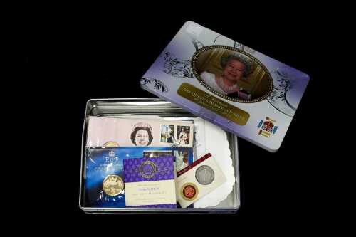Tin of Royal Philatelic Numismatic Covers and collectable coins