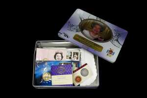 Tin of Royal Philatelic Numismatic Covers and collectable coins