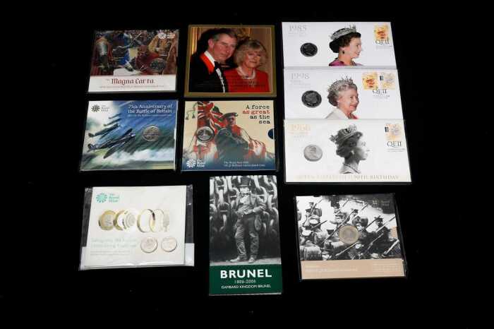 Group of United Kingdom uncirculated coins and PNCs