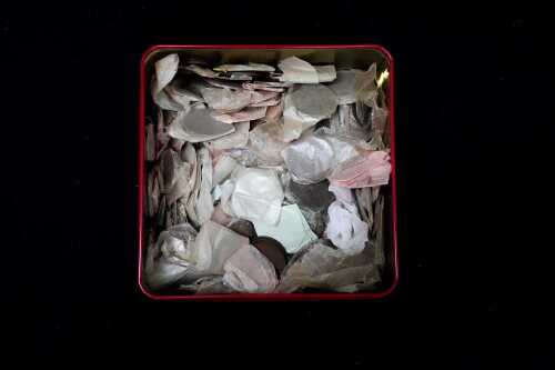 A tin of assorted Australian pennies and halfpennies