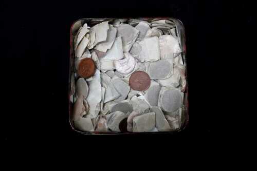 A tin of assorted Australian pennies and halfpennies