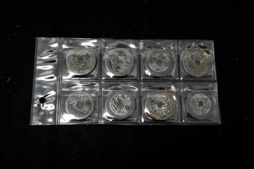 A set of eight Chinese coins, several different dynasties