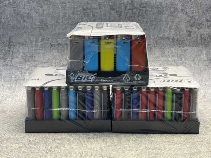 Three sealed packs of BIC lighters