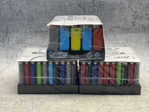 Three sealed packs of BIC lighters