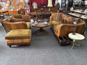 Three-piece leather lounge suite with matching ottoman