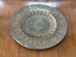 Brass platter with enamelled peacock decoration.