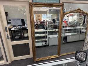 Ornate gilt framed wall mirror