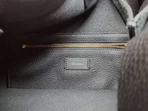 Designer-style handbag in black with gold tone hardware and red and blue belt - 4