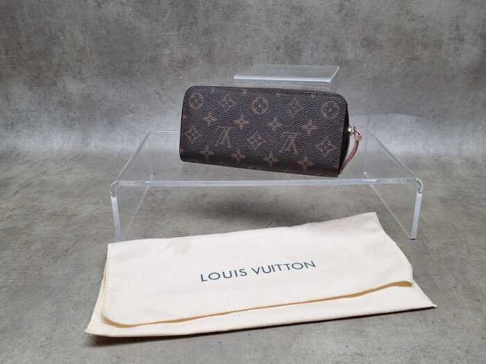 Designer-style wallet with pink lining and gold tone hardware