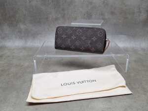 Designer-style wallet with pink lining and gold tone hardware