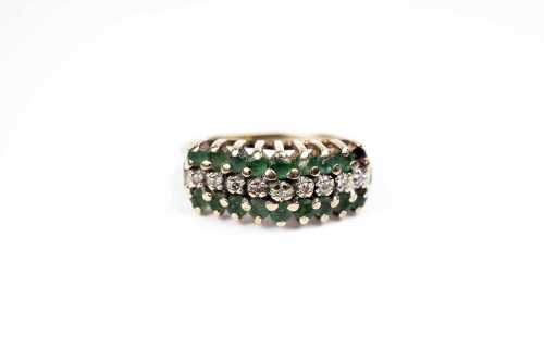 A vintage emerald and diamond ring in 9 carat yellow gold