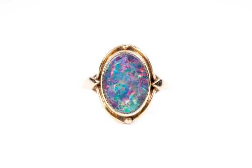 A vintage opal doublet ring in 9 carat yellow gold